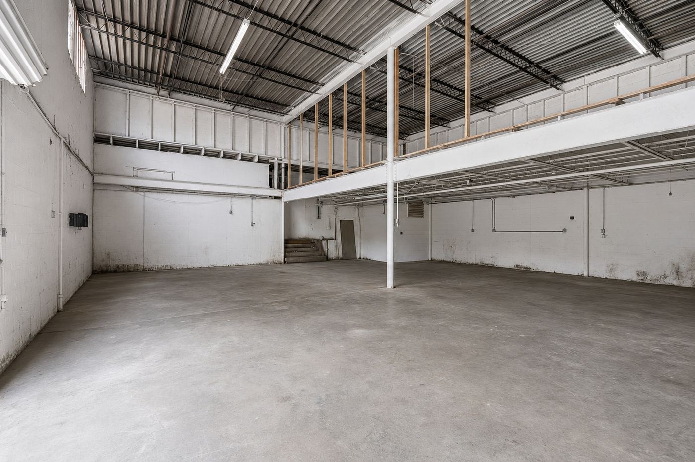 Empty warehouse interior before renovation